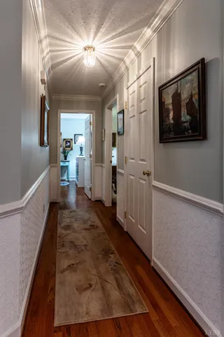 a bedroom with furniture and wooden floor
