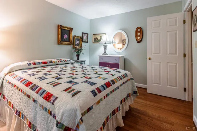 a view of a room with wooden floor and windows