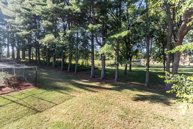 a view of a house with backyard