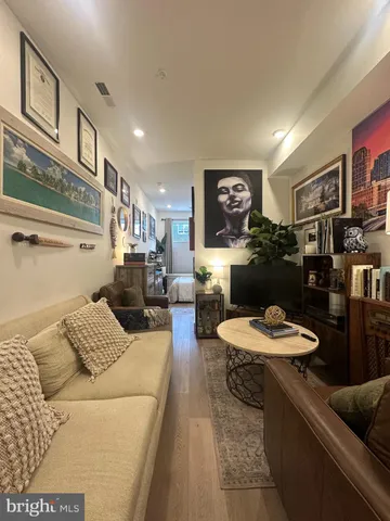 a living room with furniture and a table