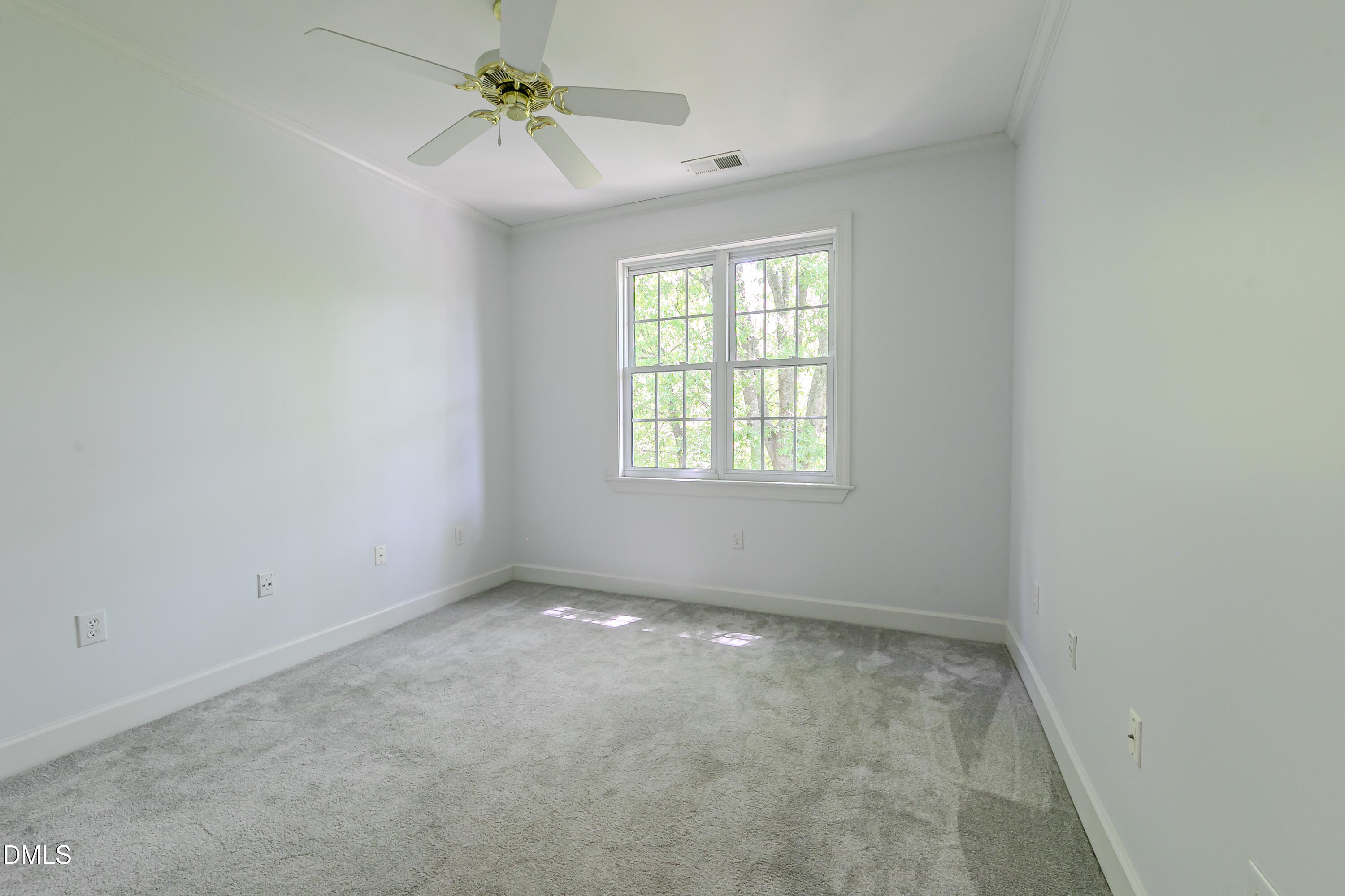 116 Northbrook Drive, Unit 305 Raleigh, NC 27609 - Photo 28 of 43 an empty room with windows and ceiling fan
