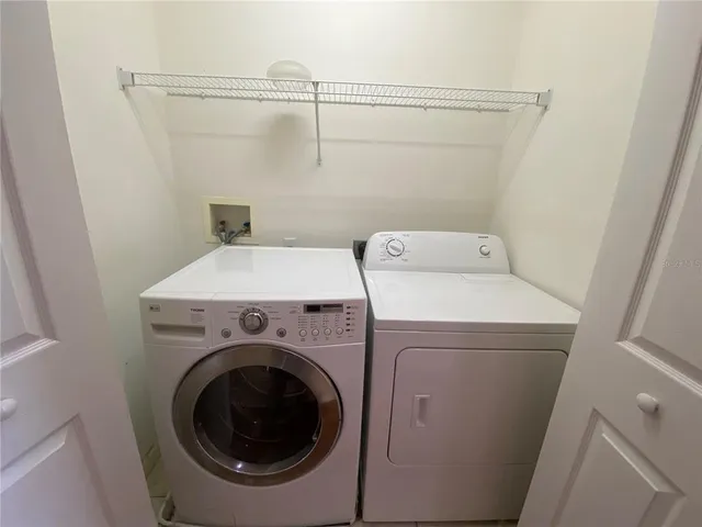 a utility room with dryer and washer