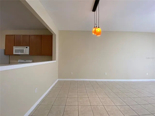 a kitchen with a sink cabinets and appliances