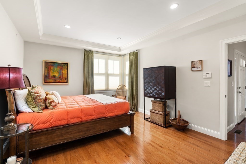 25 South Cottage Road, Unit 25 Belmont, MA 02478 - Photo 13 of 29 a bedroom with bed and wooden floor
