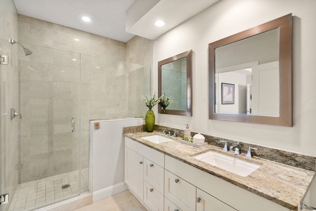 25 South Cottage Road, Unit 25 Belmont, MA 02478 - Photo 14 of 29 a bathroom with a granite countertop sink mirror and double