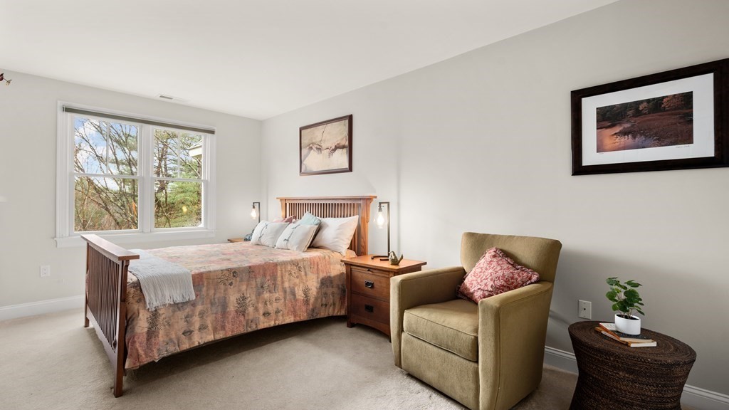 25 South Cottage Road, Unit 25 Belmont, MA 02478 - Photo 18 of 29 a bedroom with a bed and a couch