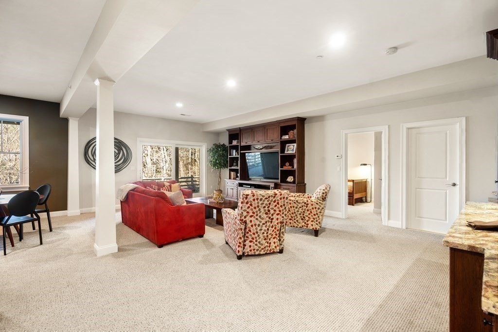 25 South Cottage Road, Unit 25 Belmont, MA 02478 - Photo 23 of 29 a living room with furniture and large windows