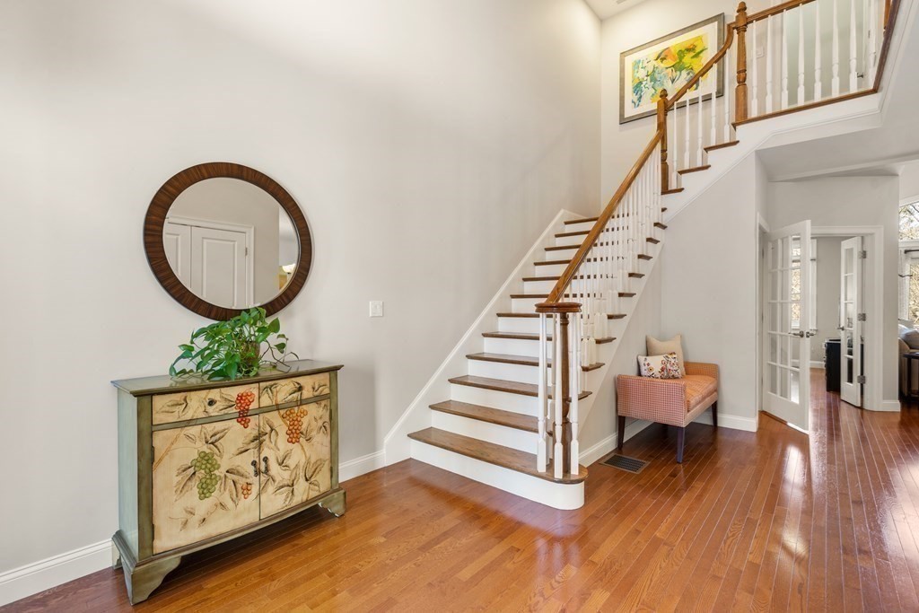 25 South Cottage Road, Unit 25 Belmont, MA 02478 - Photo 4 of 29 a view of entryway with wooden floor and stairs