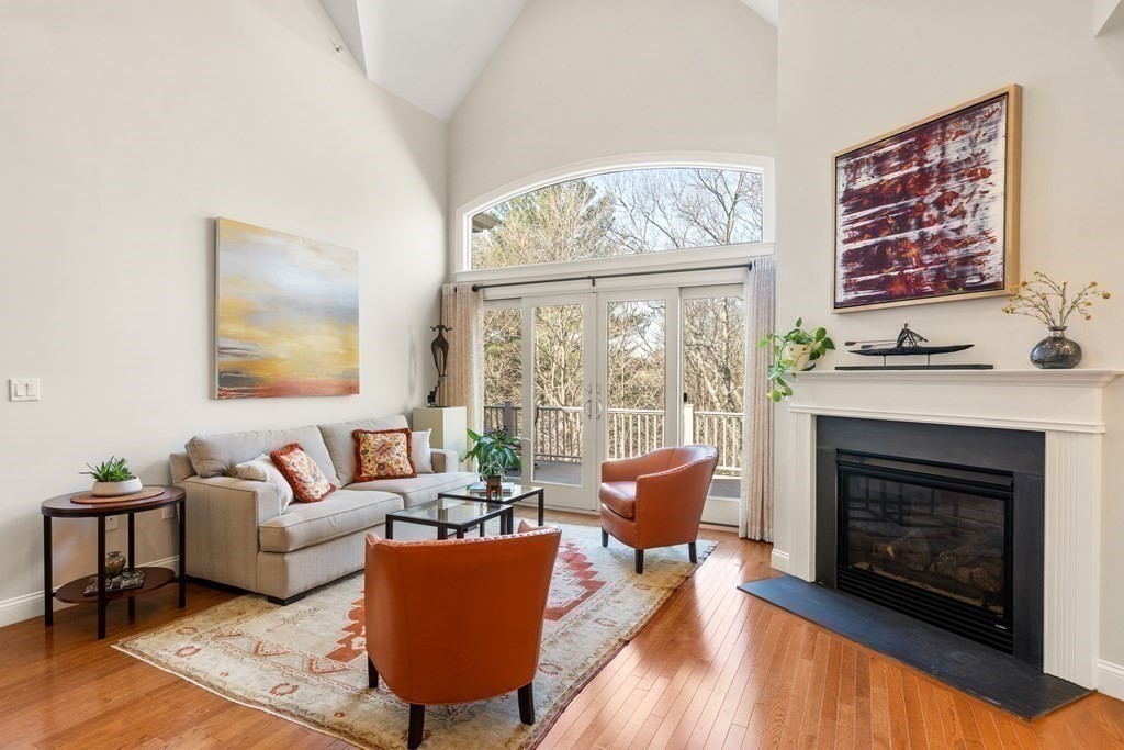 25 South Cottage Road, Unit 25 Belmont, MA 02478 - Photo 6 of 29 a living room with furniture a table and a fireplace