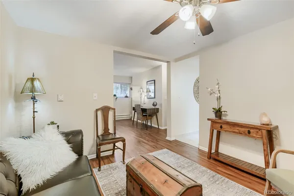 a bedroom with furniture and a mirror