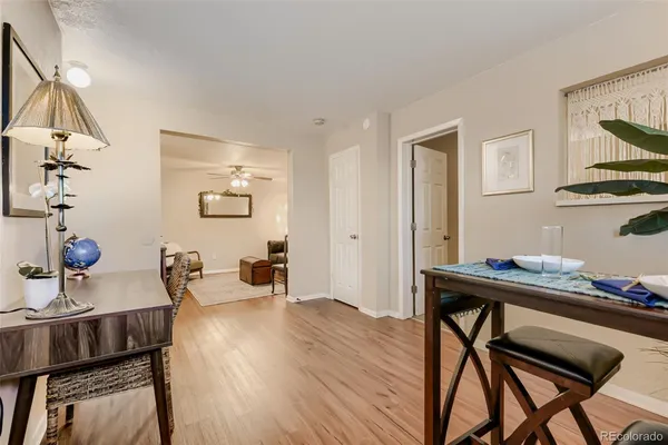 a view of a dining room with furniture and wooden floor