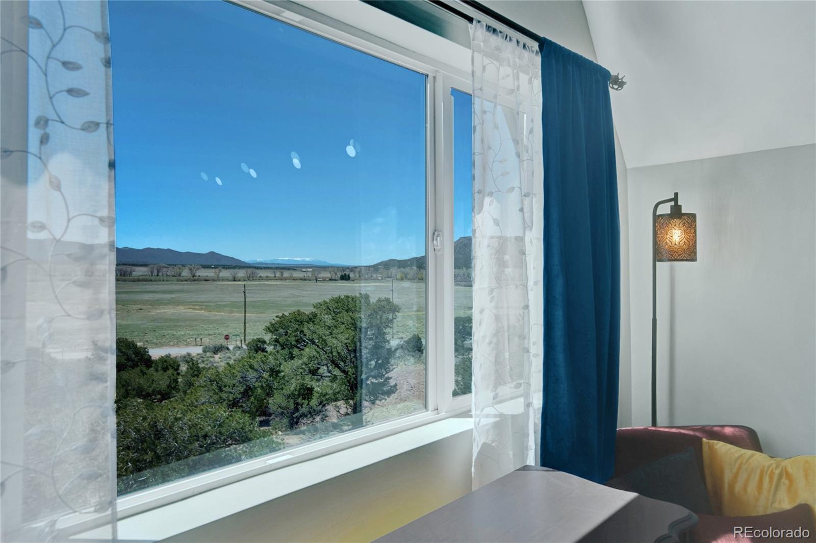 6949 Debutts Road Fort Garland, CO 81133 - Photo 25 of 48 a view of a balcony with chair and table