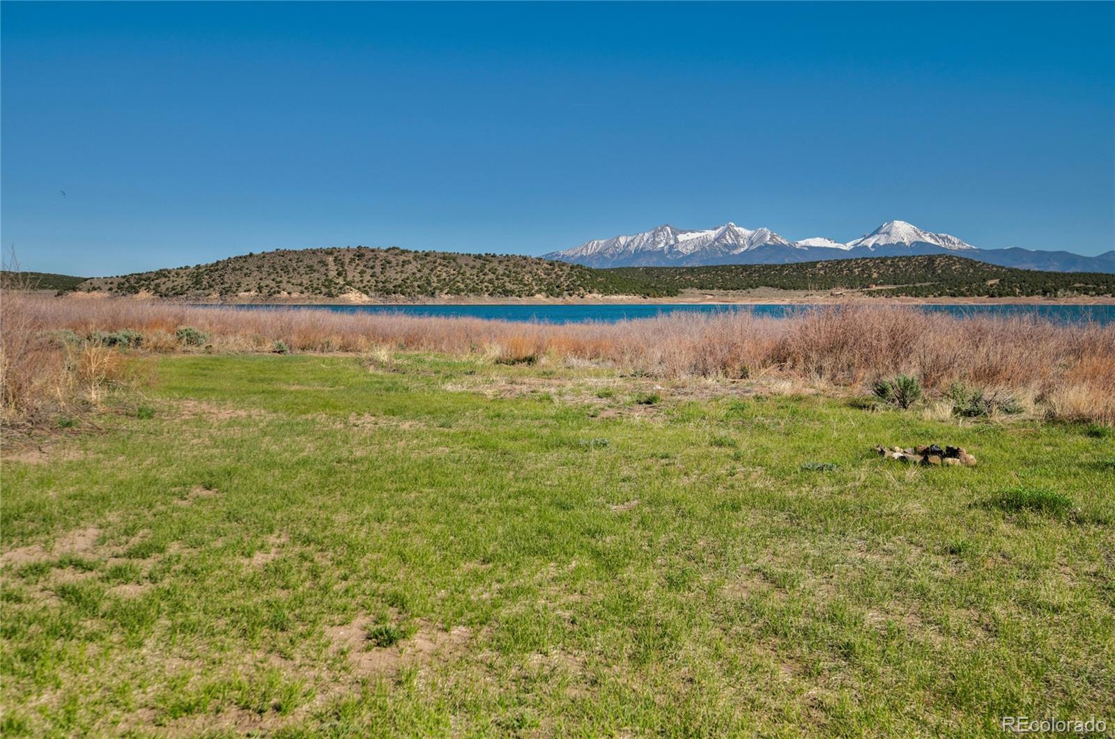 6949 Debutts Road Fort Garland, CO 81133 - Photo 48 of 48 a view of a lake with a yard
