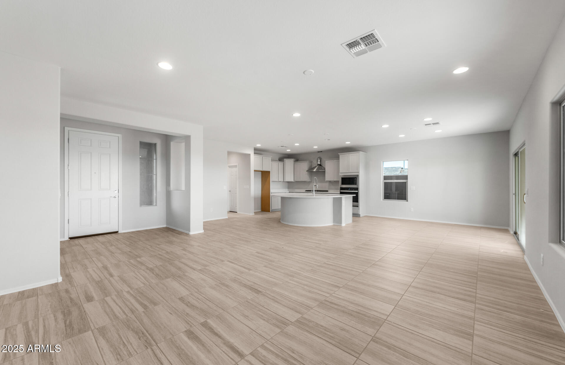 6795 West Ripken Way Florence, AZ 85132 - Photo 12 of 35 a view of a kitchen with a sink and a refrigerator