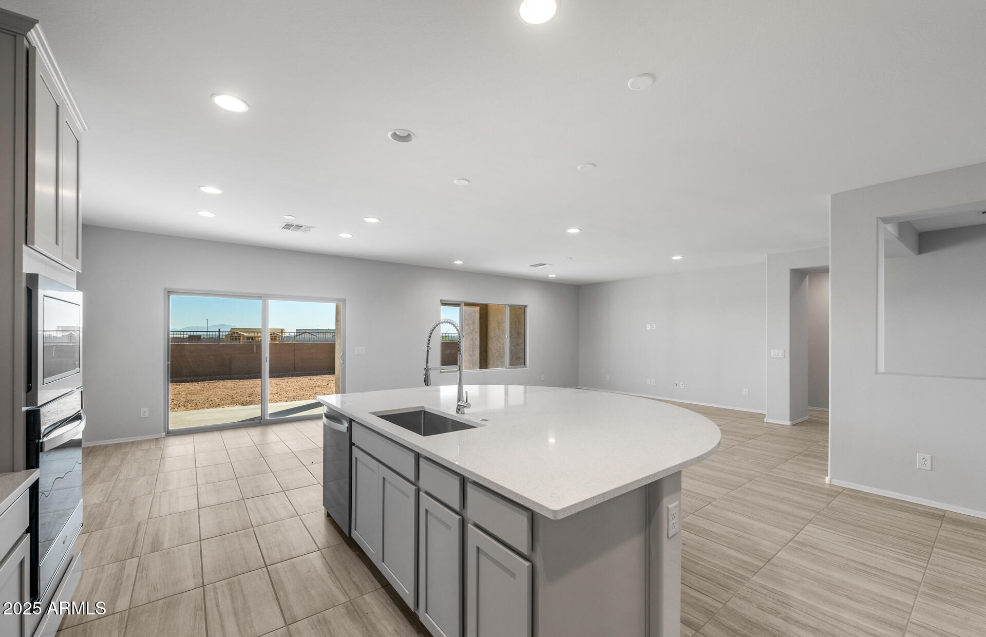 6795 West Ripken Way Florence, AZ 85132 - Photo 19 of 35 a kitchen with a sink and wooden floor