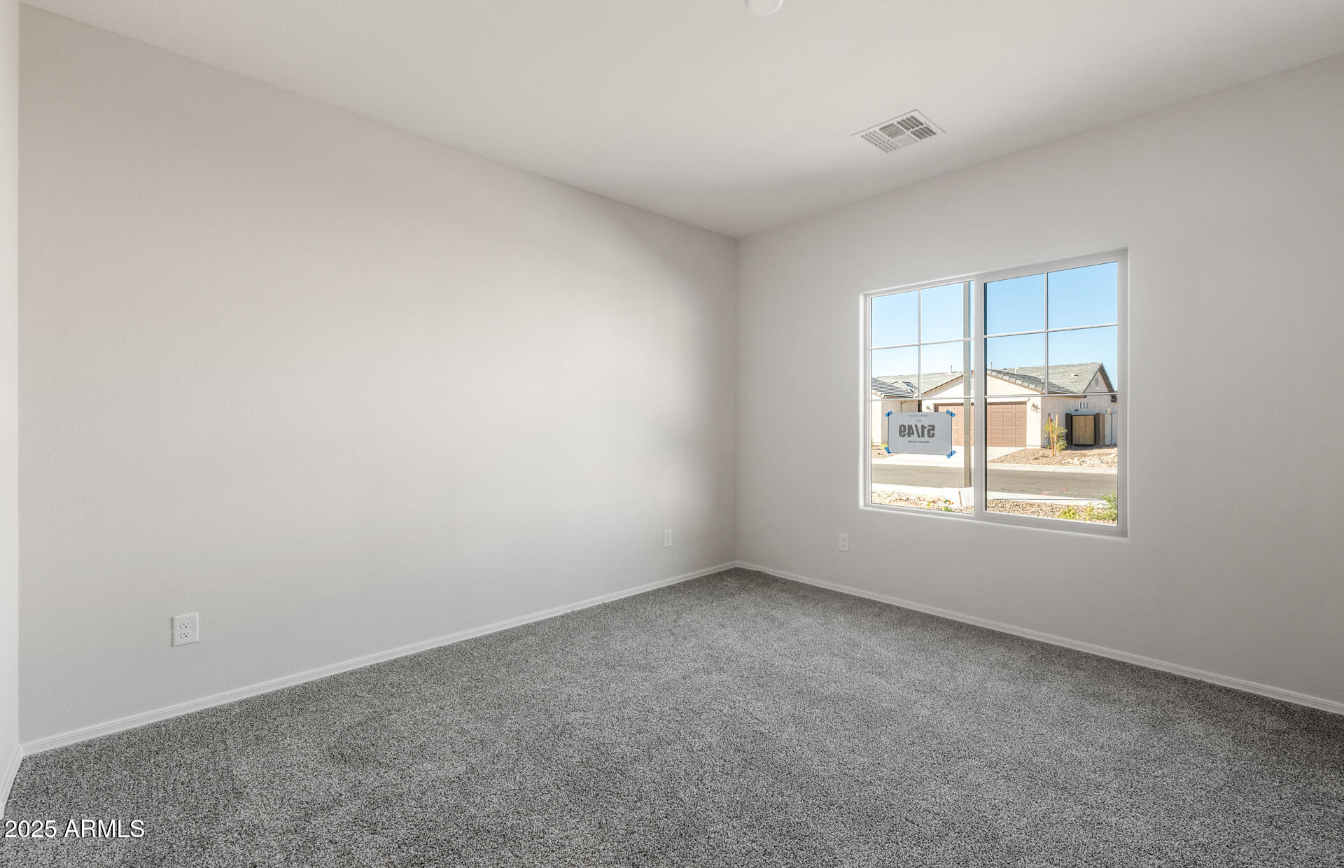 6795 West Ripken Way Florence, AZ 85132 - Photo 25 of 35 an empty room with a window