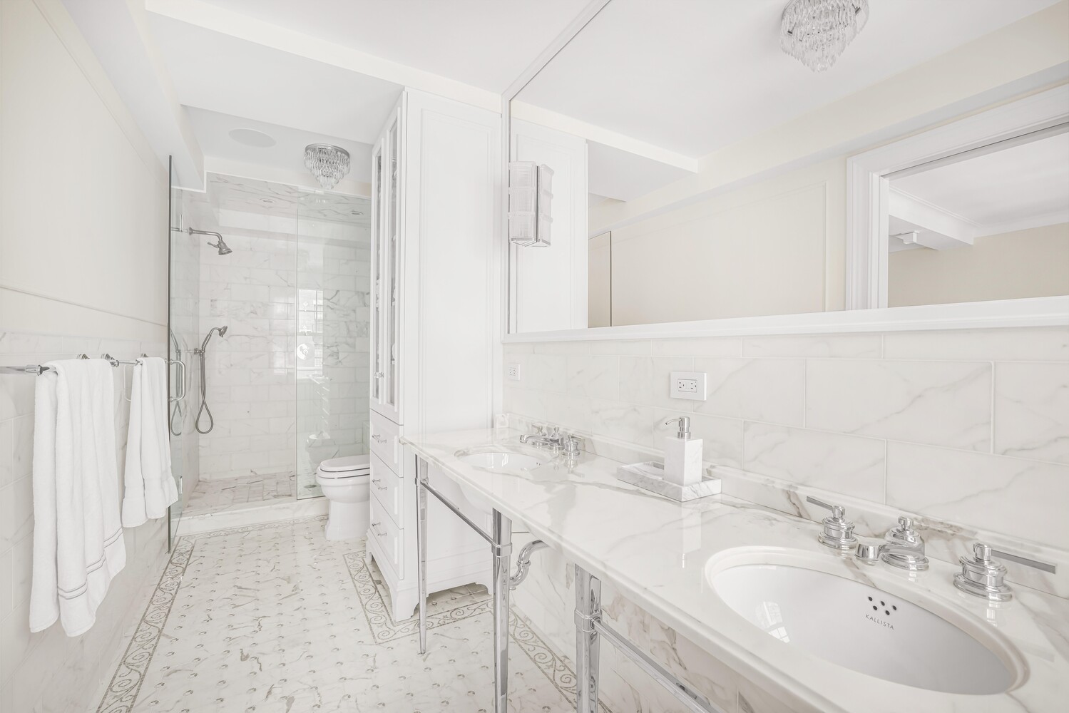 785 Park Avenue, Unit 13DE Manhattan, NY 10021 - Photo 10 of 15 a bathroom with a sink a toilet and shower