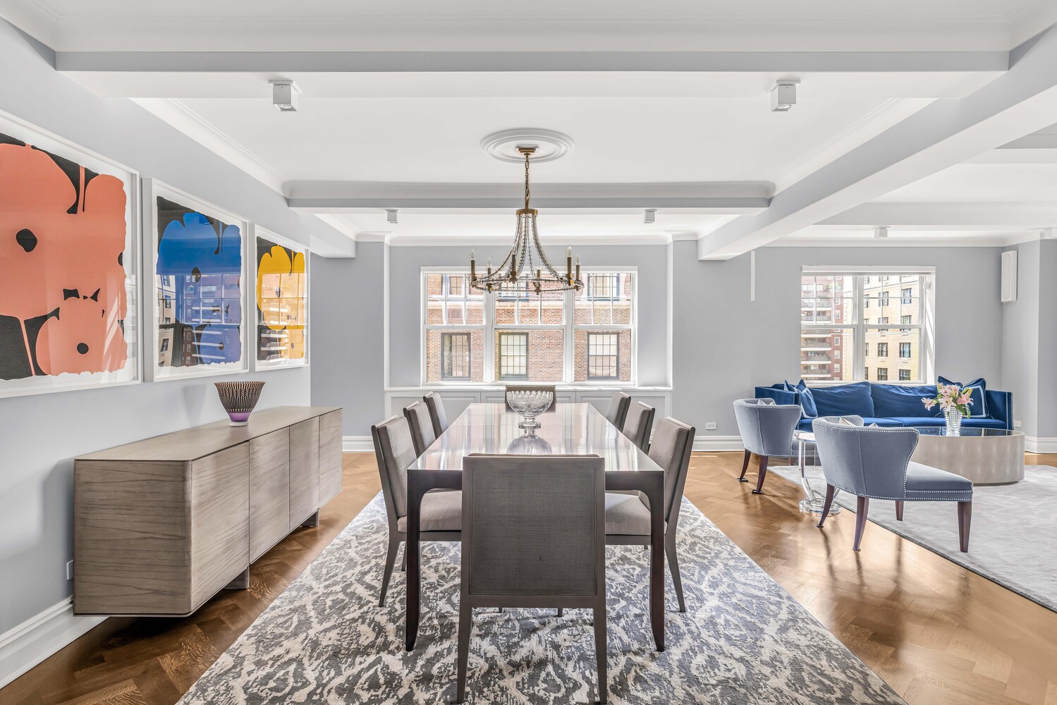 785 Park Avenue, Unit 13DE Manhattan, NY 10021 - Photo 2 of 15 a view of a dining room with furniture window and wooden floor