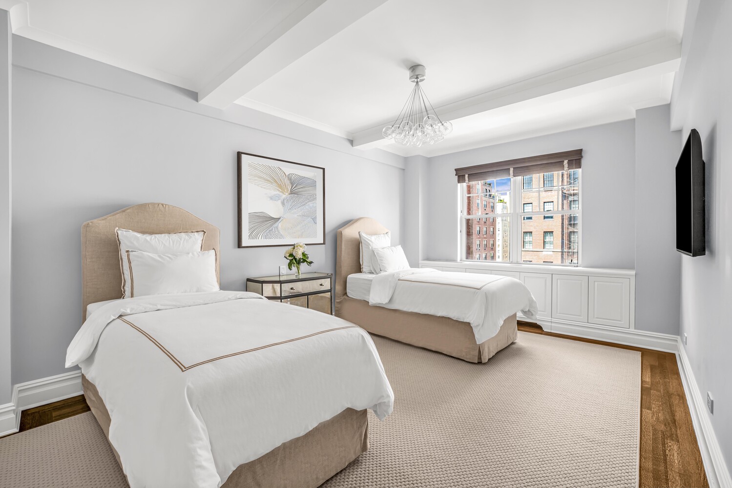 785 Park Avenue, Unit 13DE Manhattan, NY 10021 - Photo 8 of 15 a spacious bedroom with two beds and a window