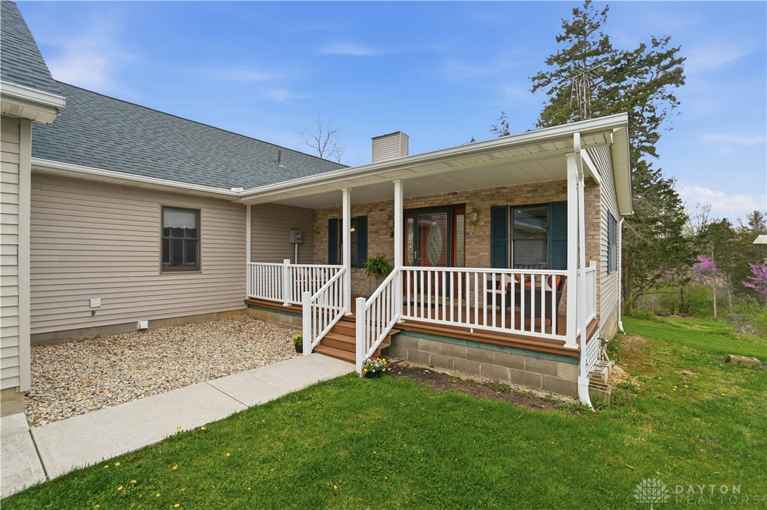 7553 Coffin Station Road Springfield, OH 45502 - Photo 10 of 95 This charming home welcomes you with a classic front porch, perfect for enjoying peaceful outdoor moments.