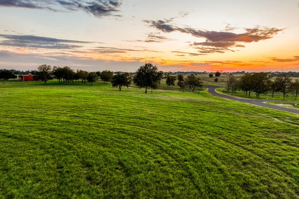 a view of a golf course with a lake