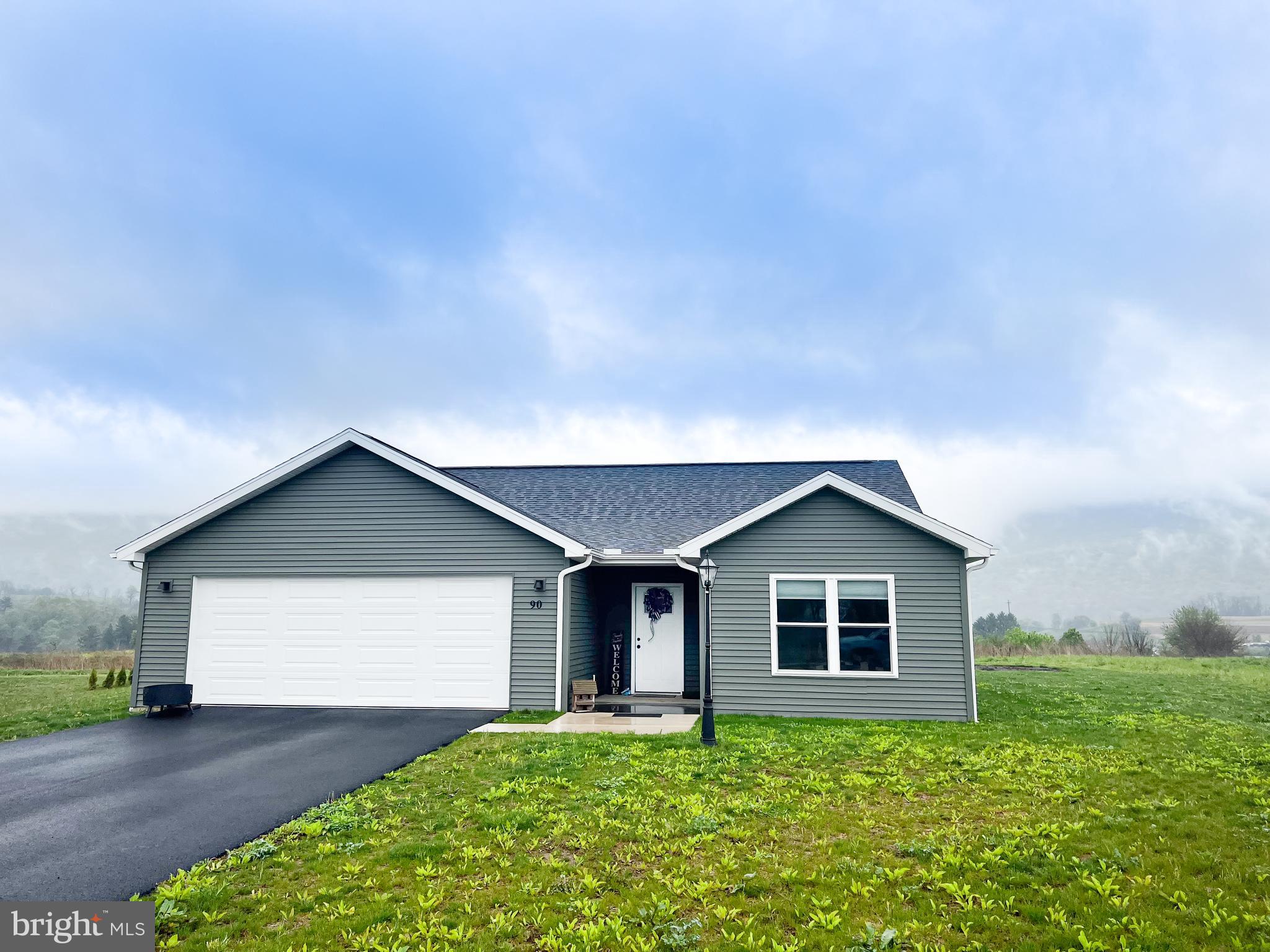 90 Tilbury Lane Reedsville, PA 17084 - Photo 1 of 28 a front view of house with yard and garage
