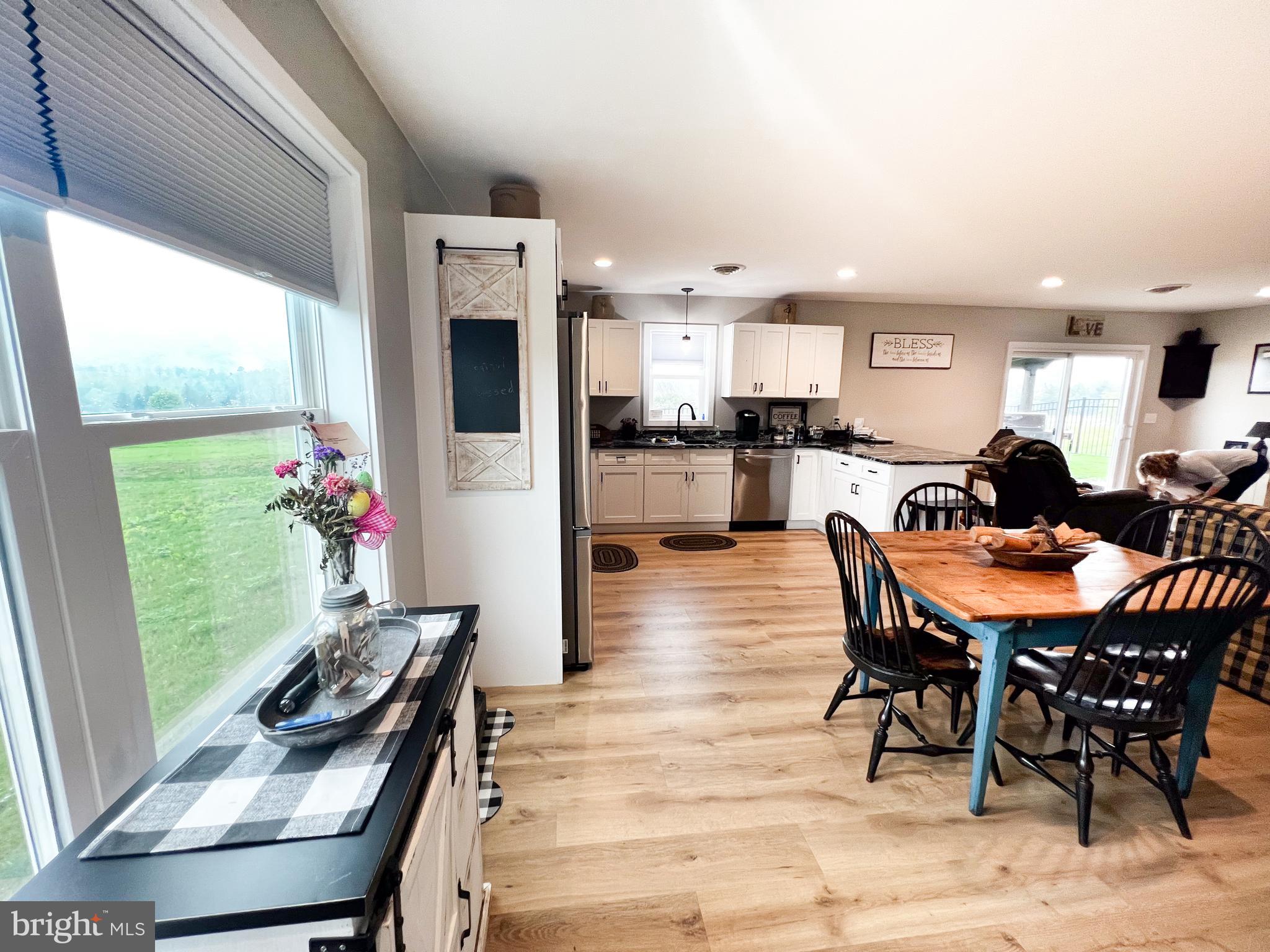 90 Tilbury Lane Reedsville, PA 17084 - Photo 11 of 28 a view of a dining room with furniture window and wooden floor