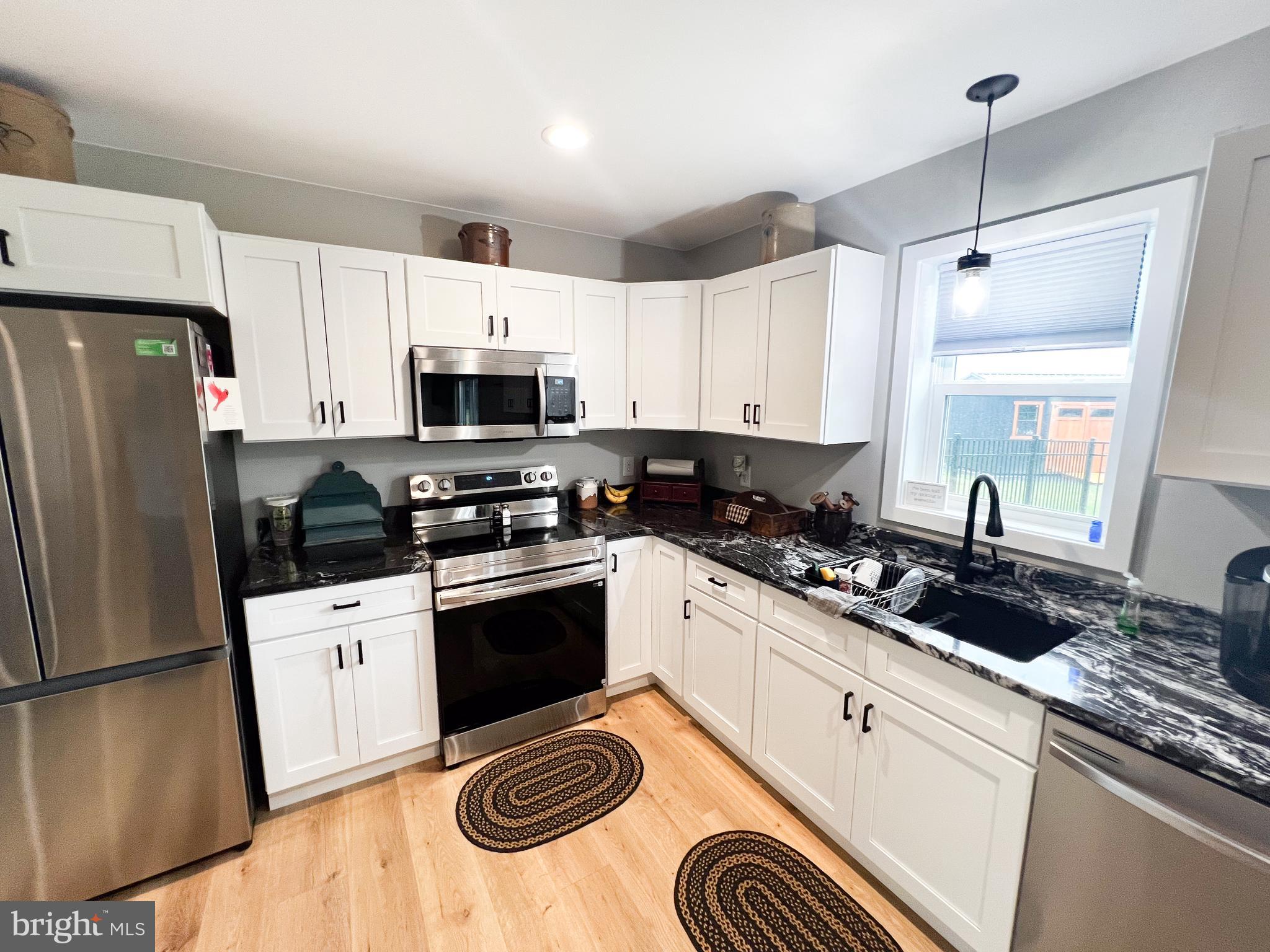 90 Tilbury Lane Reedsville, PA 17084 - Photo 17 of 28 a kitchen with stainless steel appliances a refrigerator sink and microwave