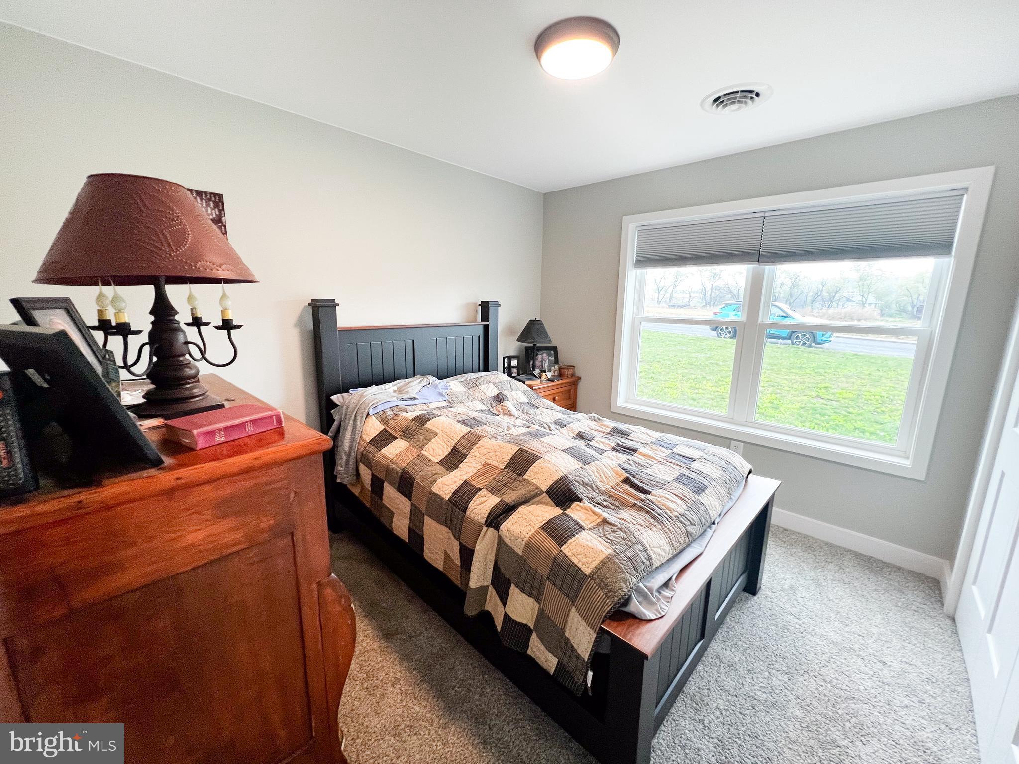 90 Tilbury Lane Reedsville, PA 17084 - Photo 18 of 28 a bed sitting in a bedroom next to a window