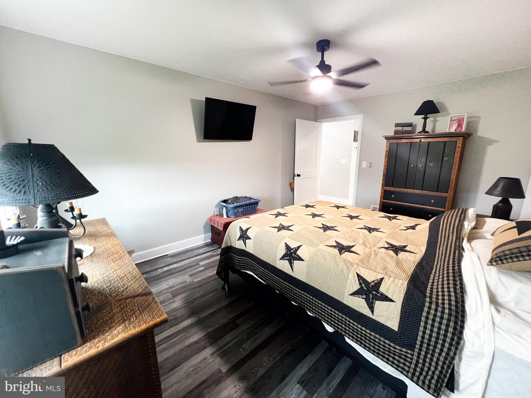 90 Tilbury Lane Reedsville, PA 17084 - Photo 24 of 28 a bedroom with bed and a flat tv screen on dresser