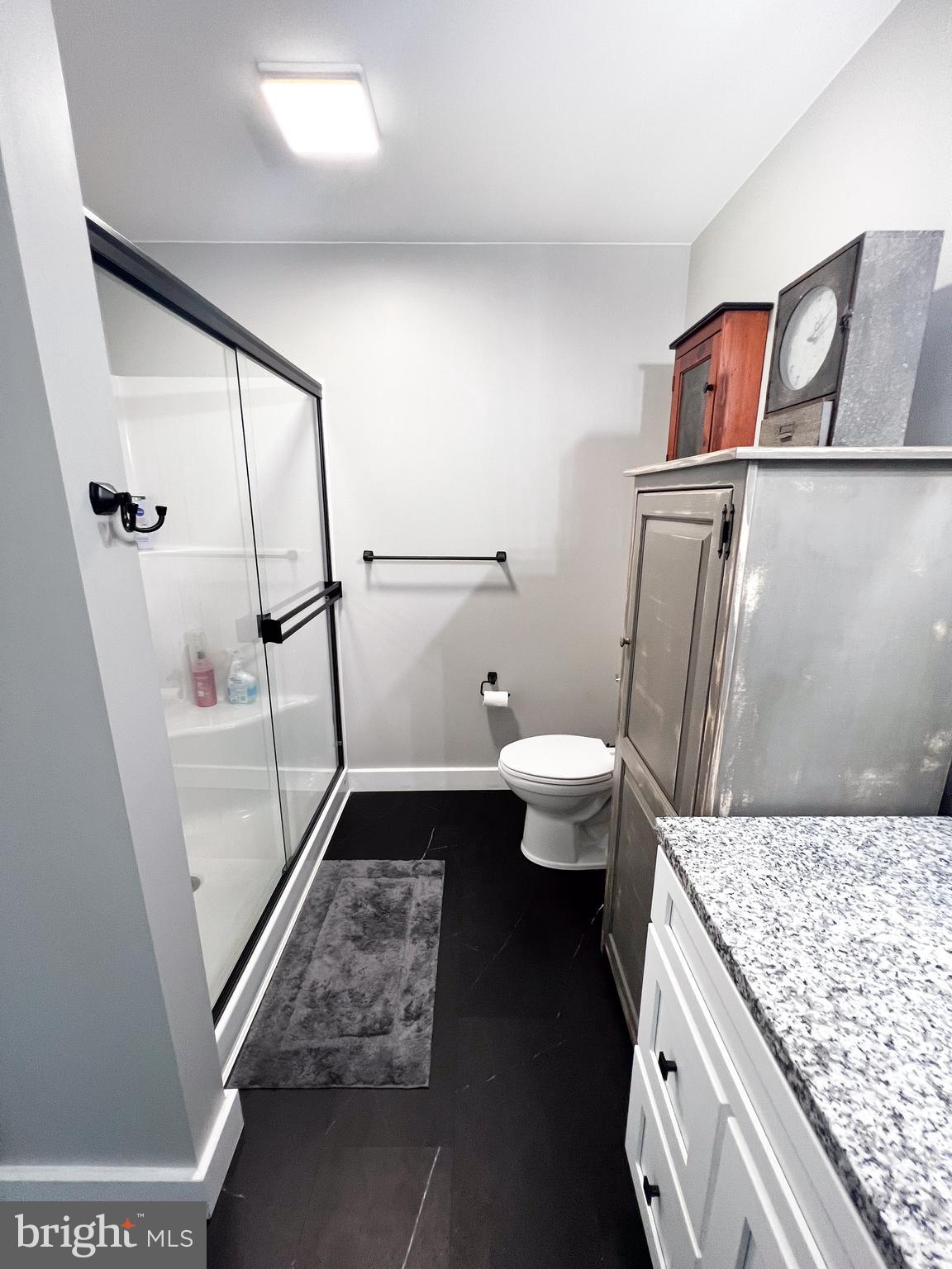 90 Tilbury Lane Reedsville, PA 17084 - Photo 26 of 28 a bathroom with a granite countertop sink toilet and shower
