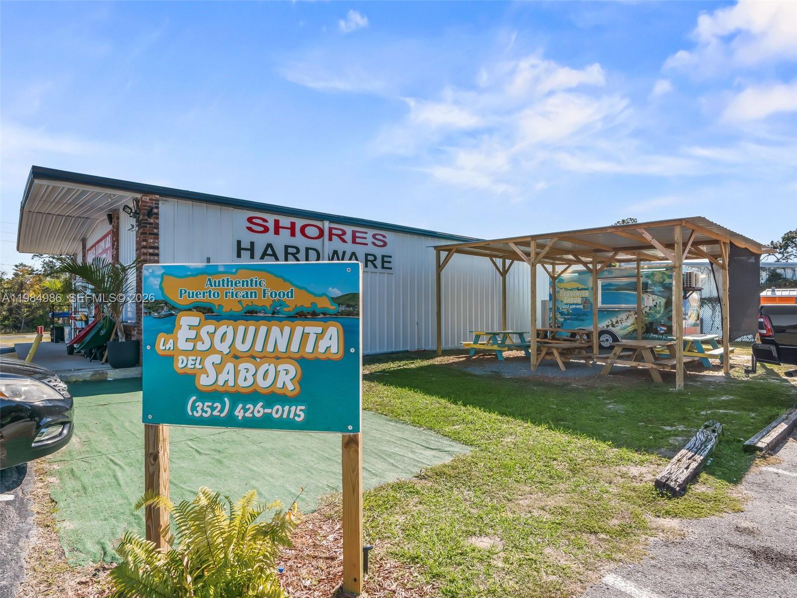 9594 Southeast Maricamp Road Ocala, FL 34472 - Photo 16 of 45 a sign on the side of the building