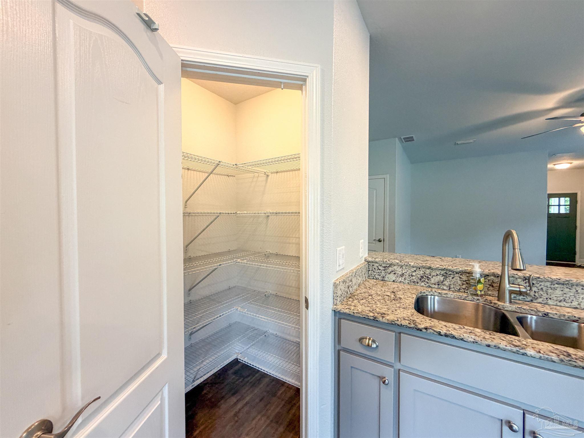 3613 Conley Drive Cantonment, FL 32533 - Photo 7 of 32 a bathroom with a granite countertop sink and a mirror