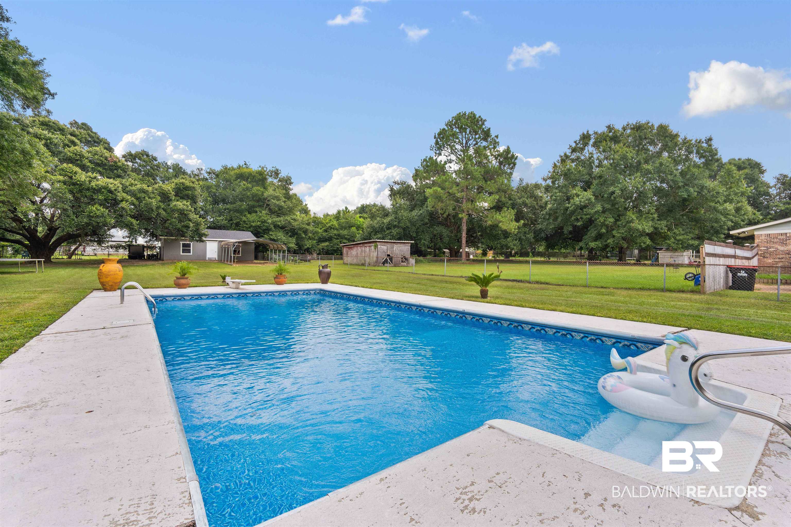 2000 Campfire Drive Semmes, AL 36575 - Photo 3 of 26 View of pool with a lawn
