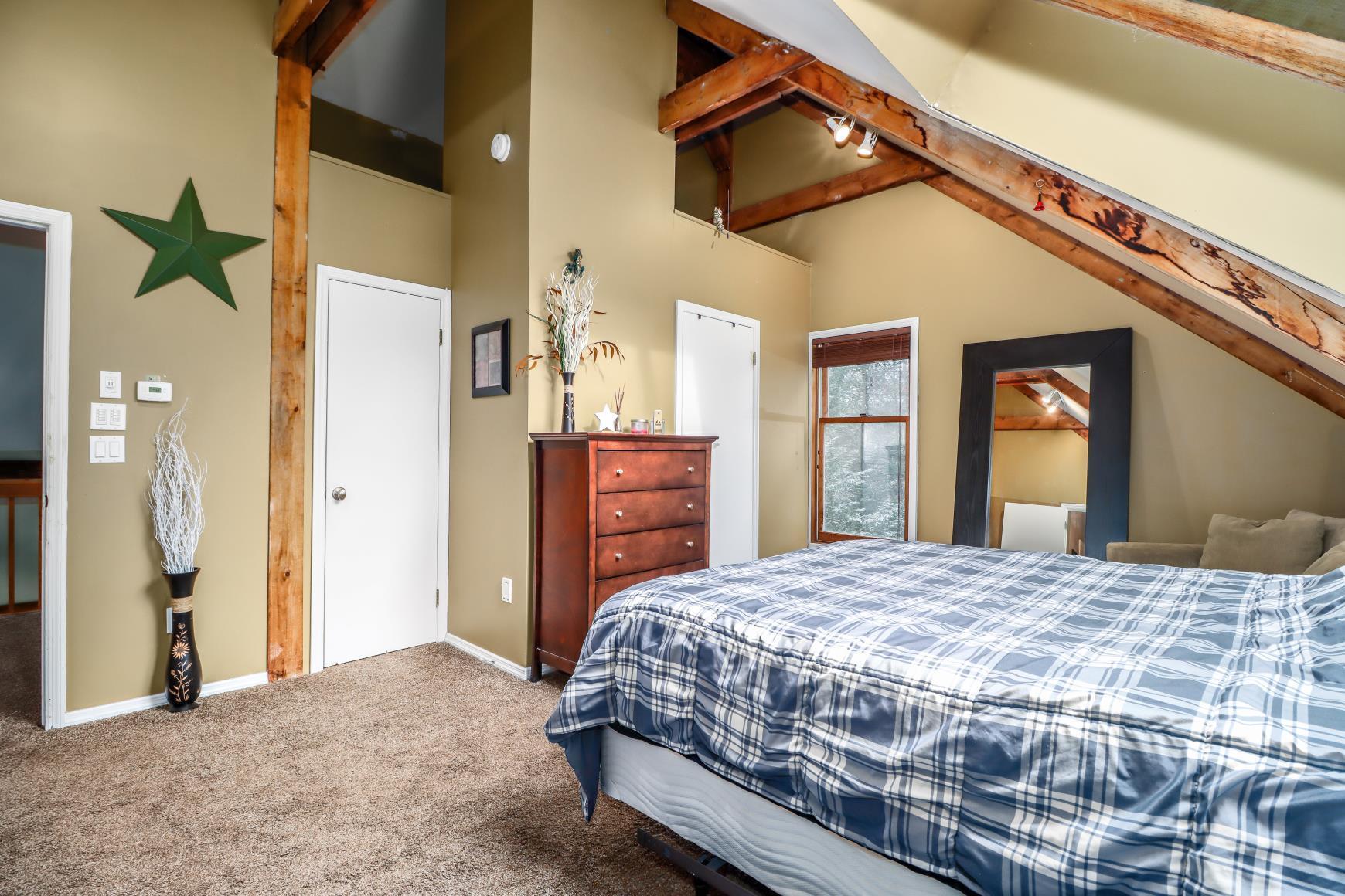 56 East Starrs Plain Road Danbury, CT 06810 - Photo 13 of 37 a bedroom with a bed and a large mirror on the dresser