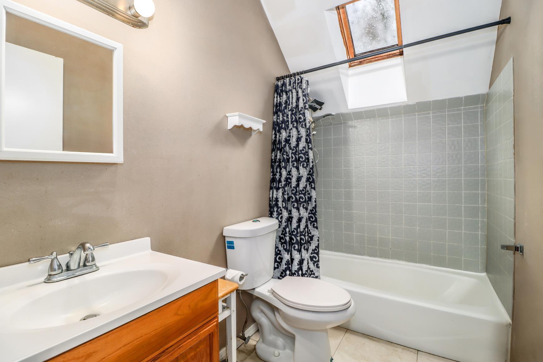 56 East Starrs Plain Road Danbury, CT 06810 - Photo 19 of 37 a bathroom with a sink toilet and shower