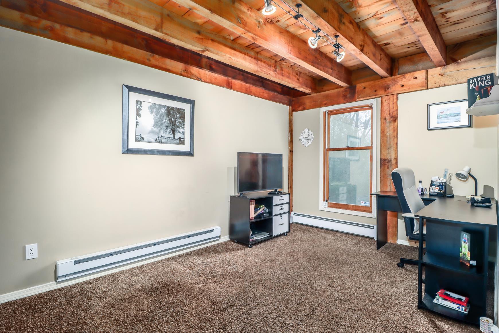 56 East Starrs Plain Road Danbury, CT 06810 - Photo 22 of 37 a view of a livingroom with furniture and a flat screen tv