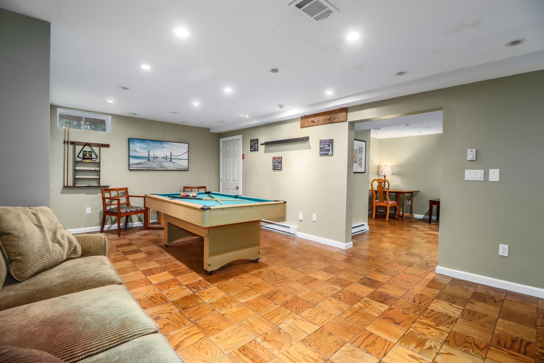 56 East Starrs Plain Road Danbury, CT 06810 - Photo 25 of 37 a living room with furniture and a table