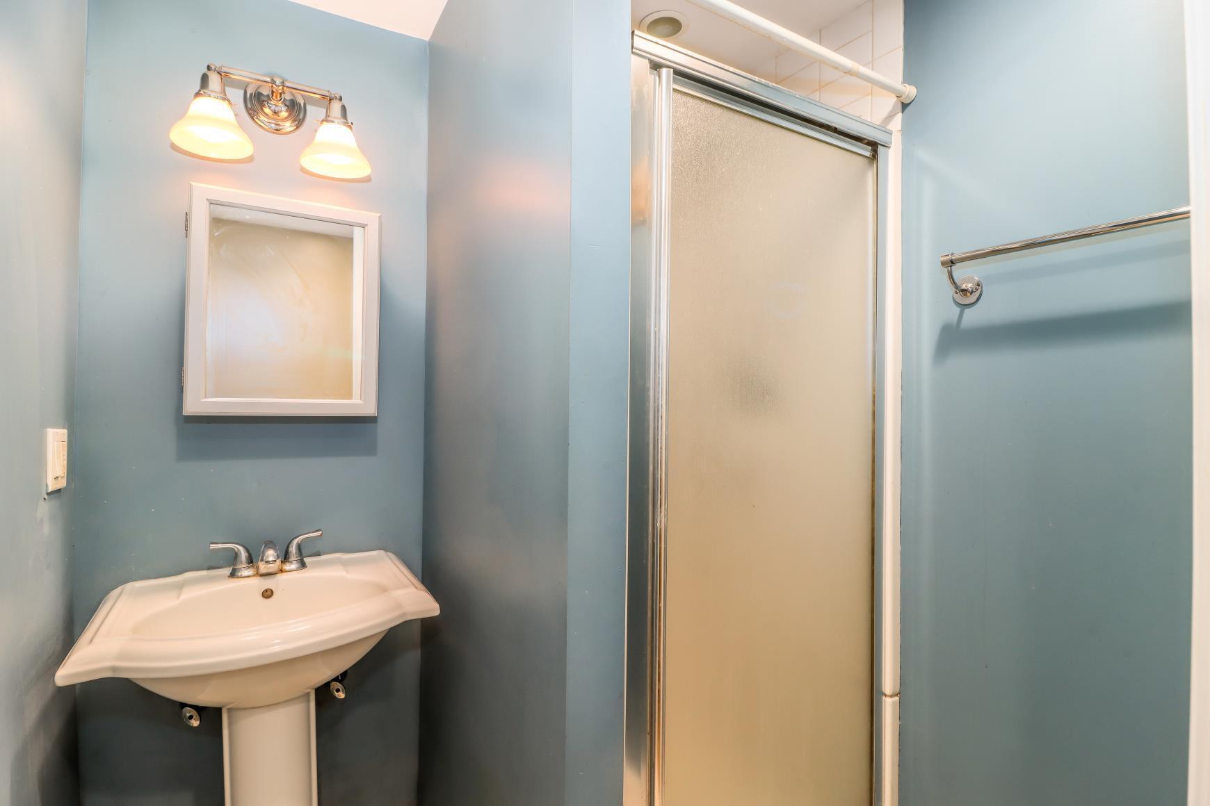 56 East Starrs Plain Road Danbury, CT 06810 - Photo 27 of 37 a bathroom with a sink and a mirror