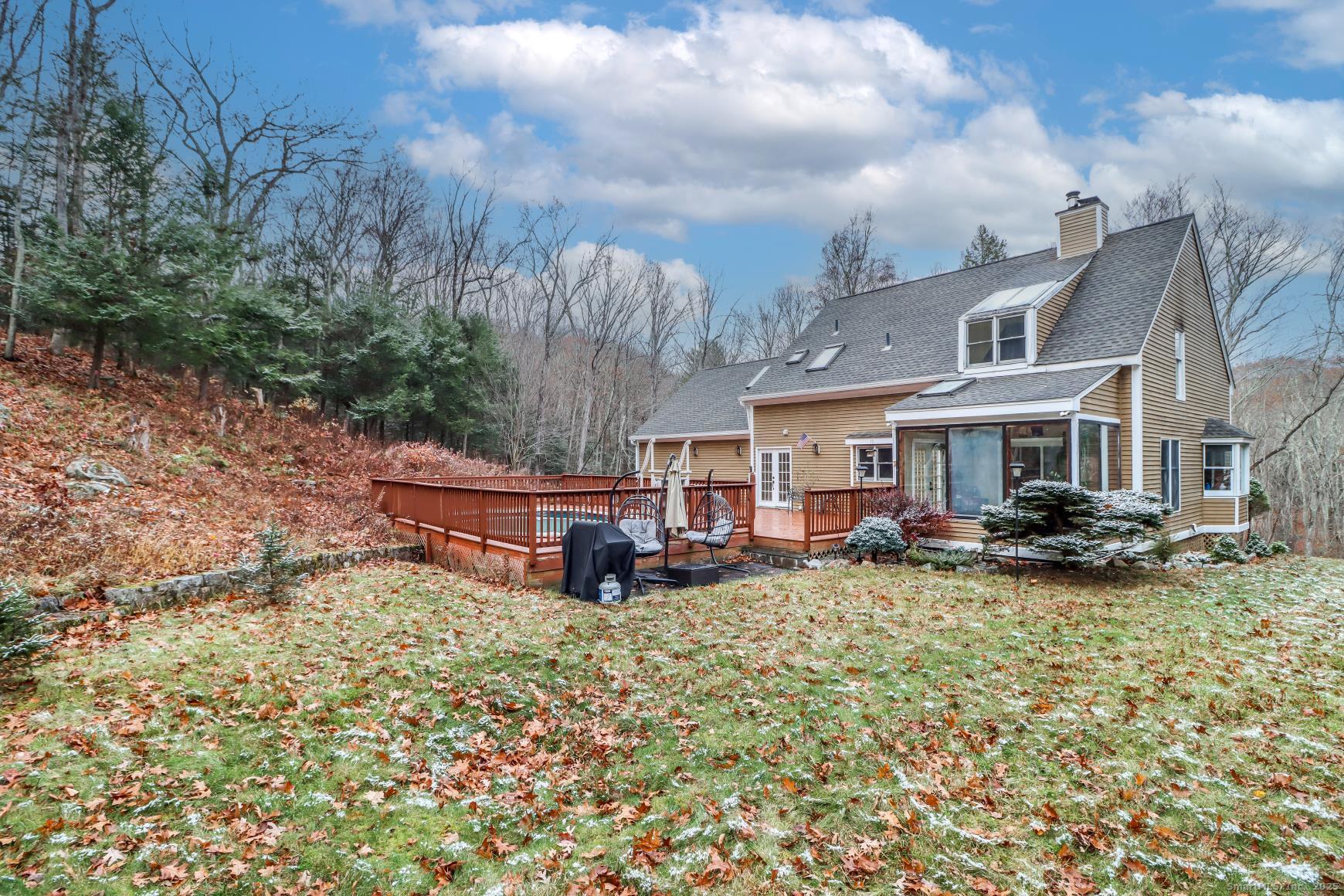 56 East Starrs Plain Road Danbury, CT 06810 - Photo 33 of 37 a view of a house with garden and sitting area