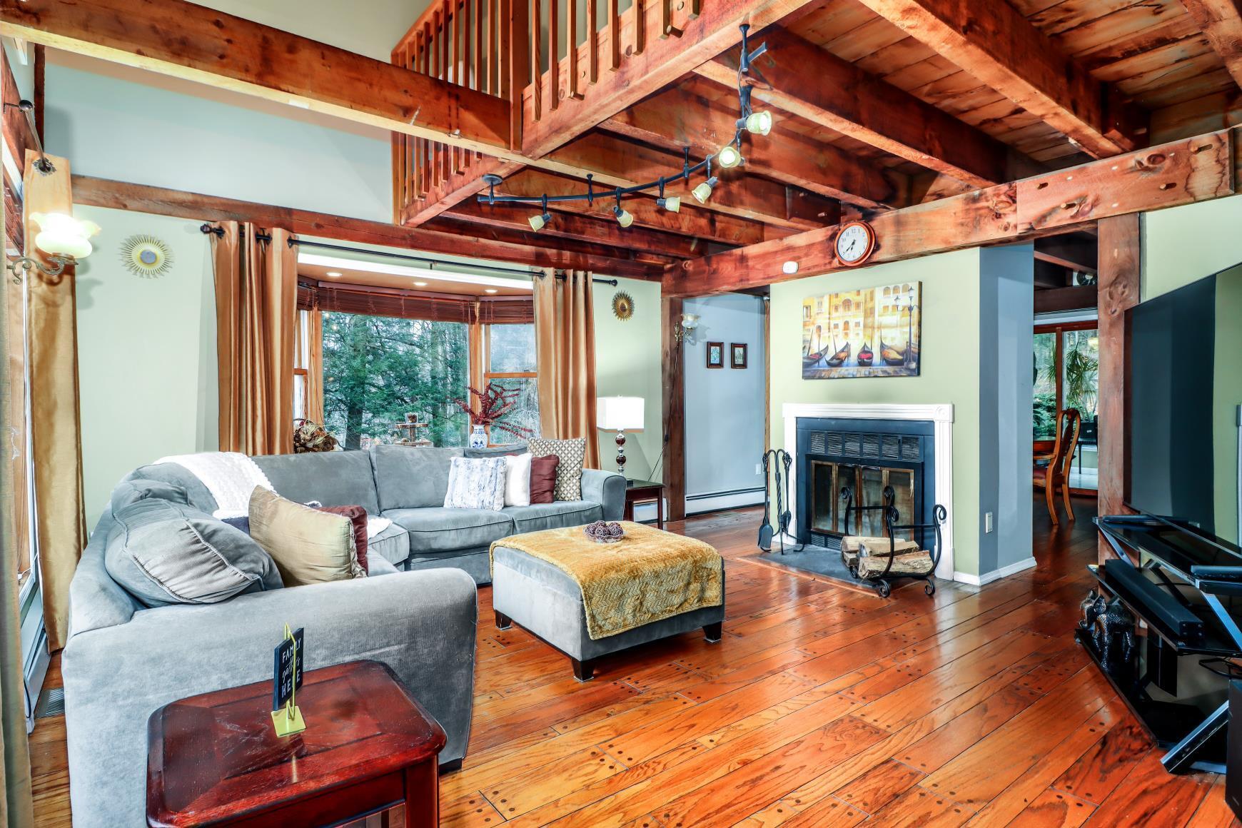 56 East Starrs Plain Road Danbury, CT 06810 - Photo 5 of 37 a living room with furniture and a fireplace