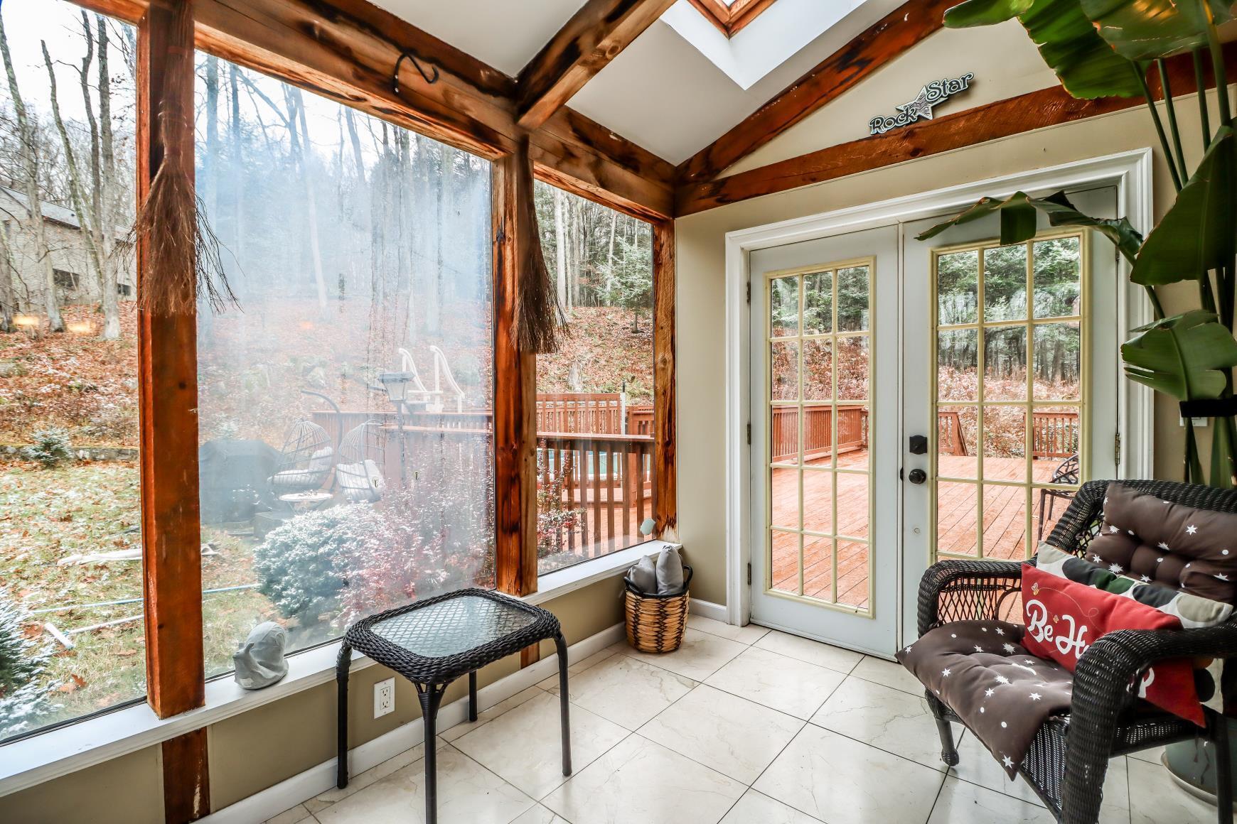56 East Starrs Plain Road Danbury, CT 06810 - Photo 10 of 37 a living room with furniture and a window