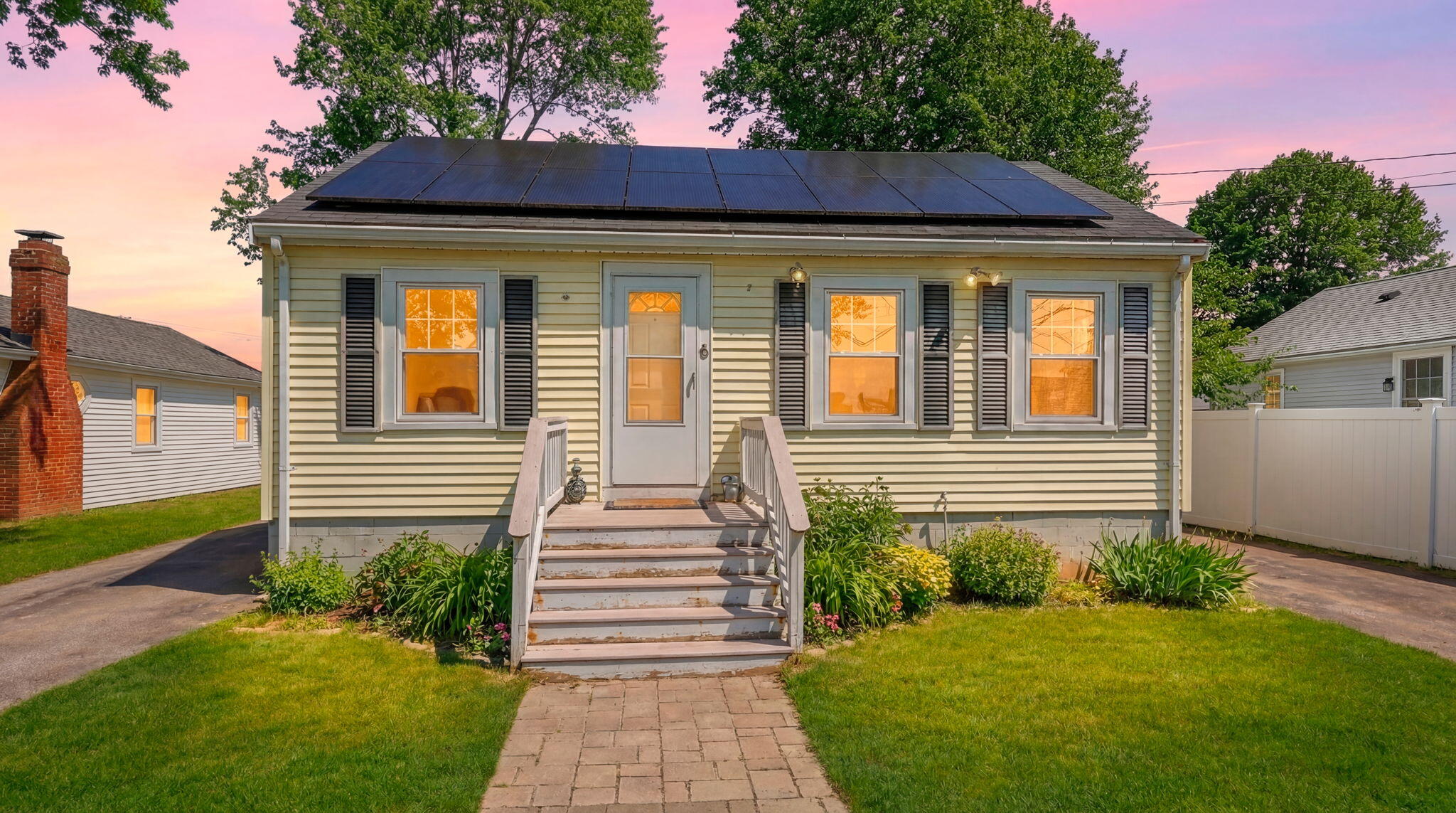 a view of a house with a yard