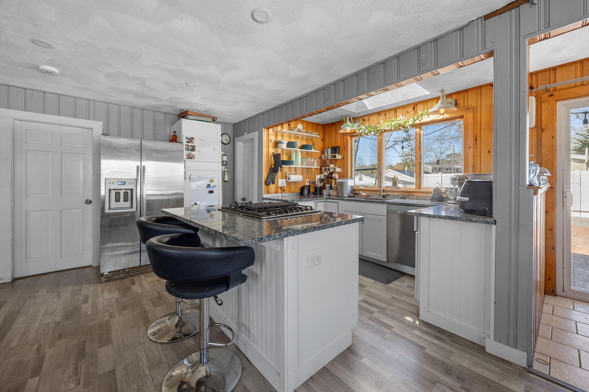 6 Pine Street Wareham, MA 02571 - Photo 11 of 32 a kitchen with granite countertop a sink appliances cabinets and dining table