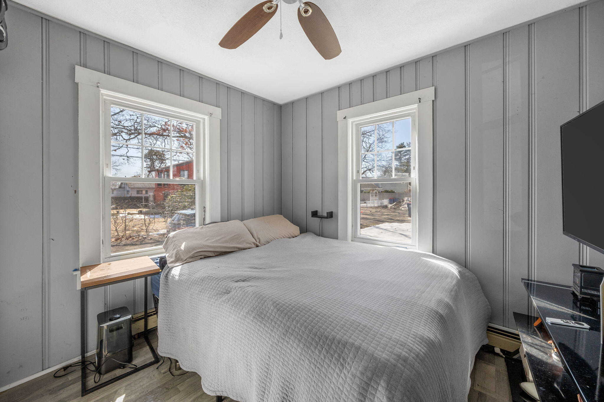 6 Pine Street Wareham, MA 02571 - Photo 16 of 32 a bedroom with a bed and a flat tv screen on the dresser