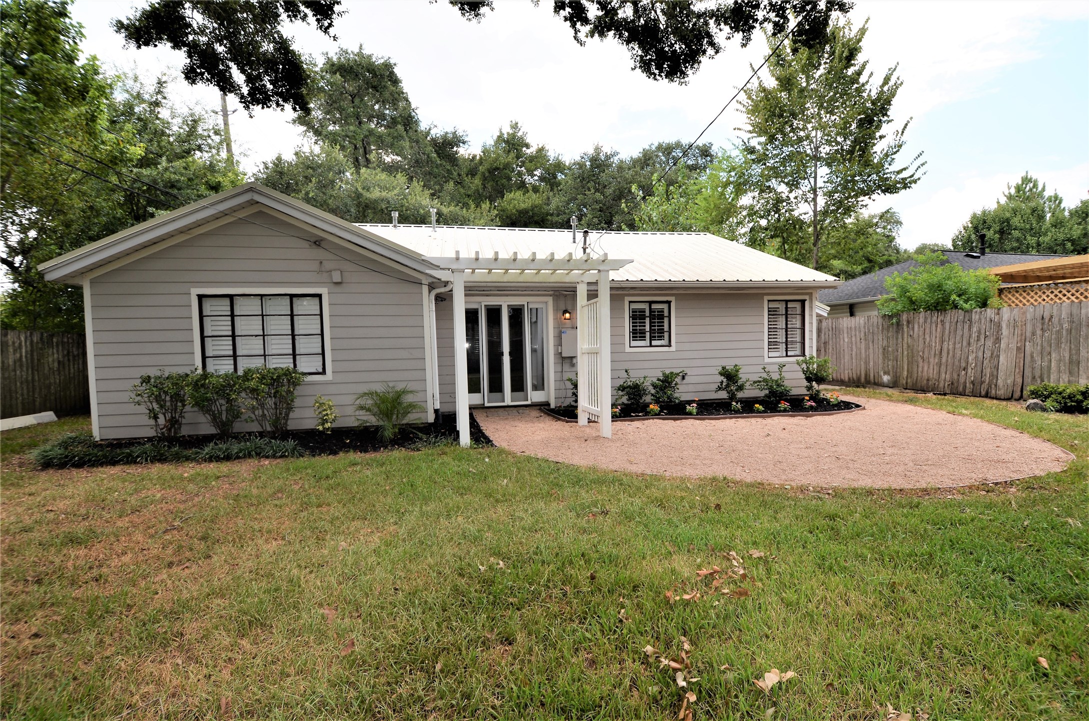 1902 Coulcrest Drive Houston, TX 77055 - Photo 18 of 27 a front view of a house with yard and green space