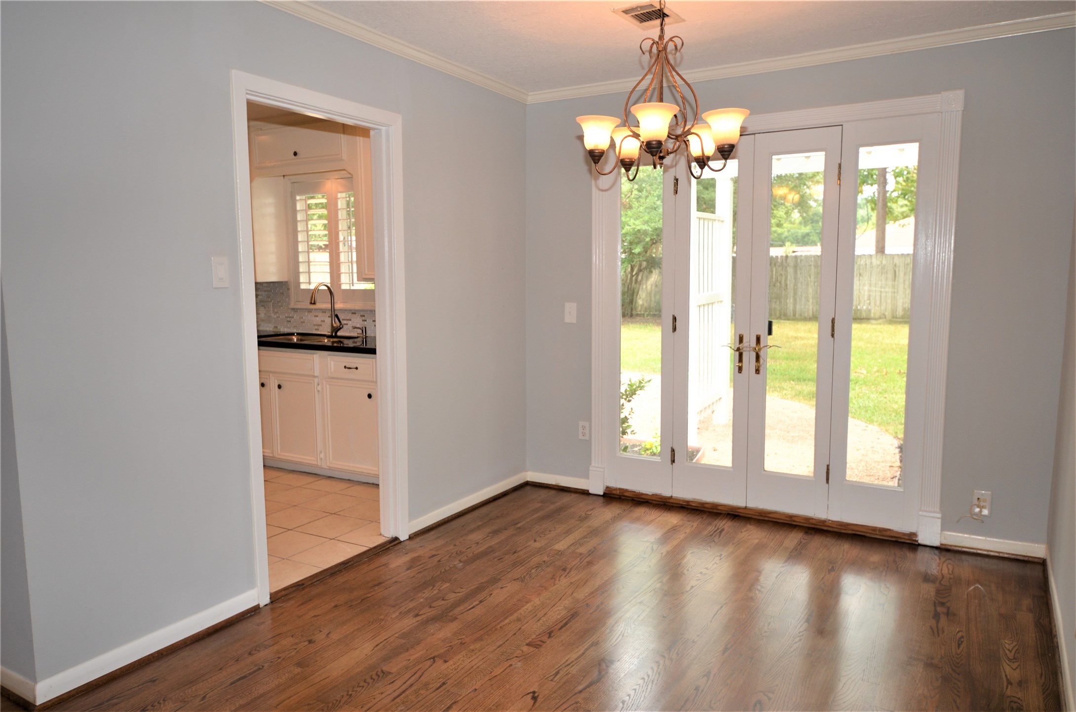 1902 Coulcrest Drive Houston, TX 77055 - Photo 5 of 27 a view of an empty room with wooden floor and a window