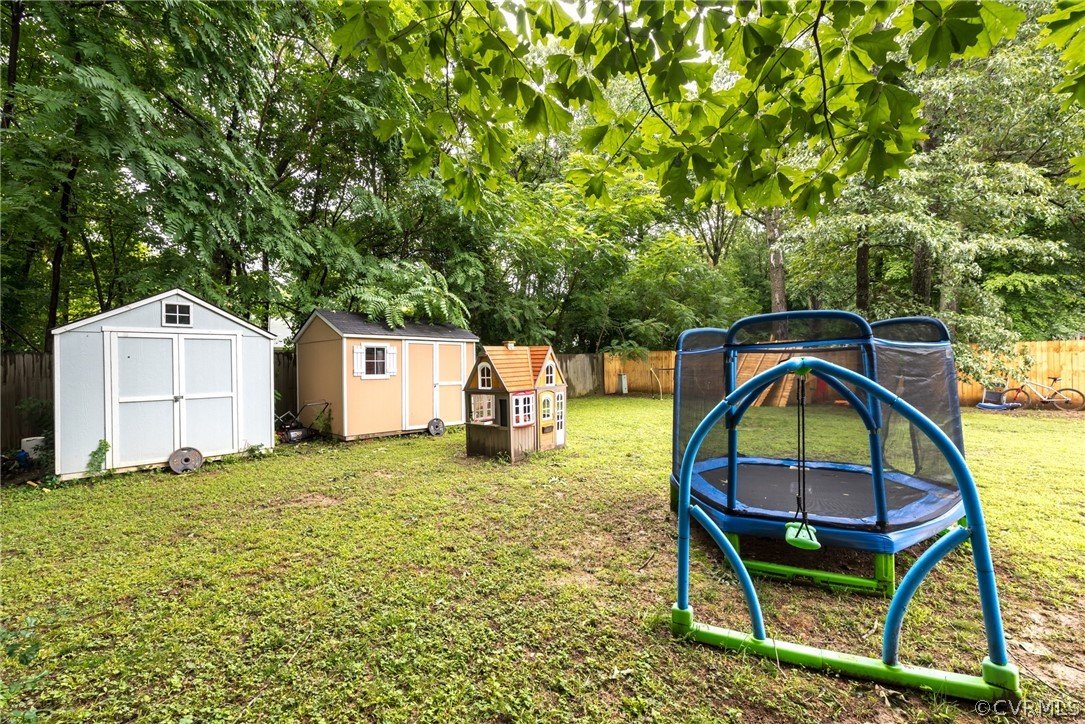 6424 Husting Road Chesterfield, VA 23832 - Photo 16 of 16 a backyard of a house with table and chairs