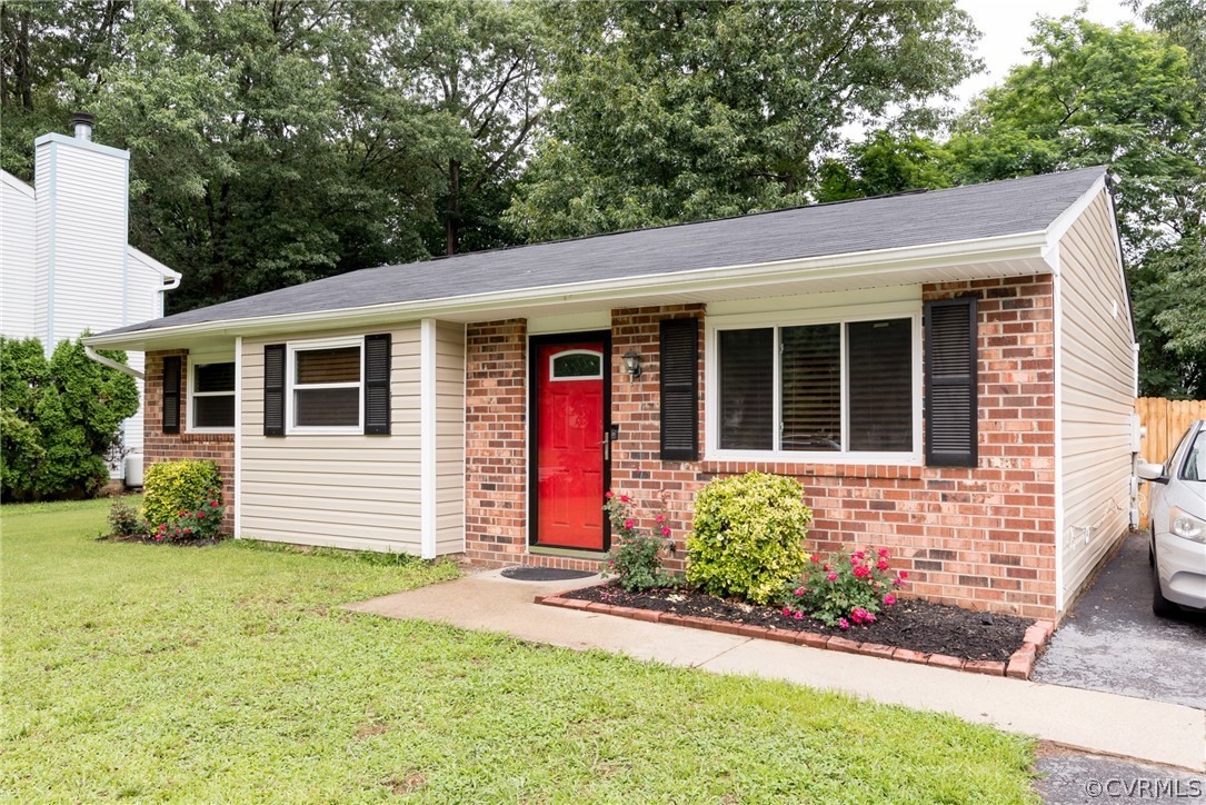 6424 Husting Road Chesterfield, VA 23832 - Photo 2 of 16 a front view of a house with garden