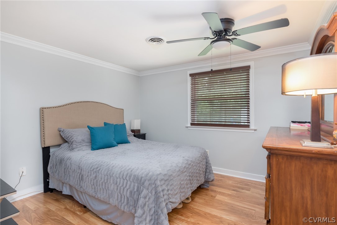 6424 Husting Road Chesterfield, VA 23832 - Photo 8 of 16 a bedroom with a bed and a table in it